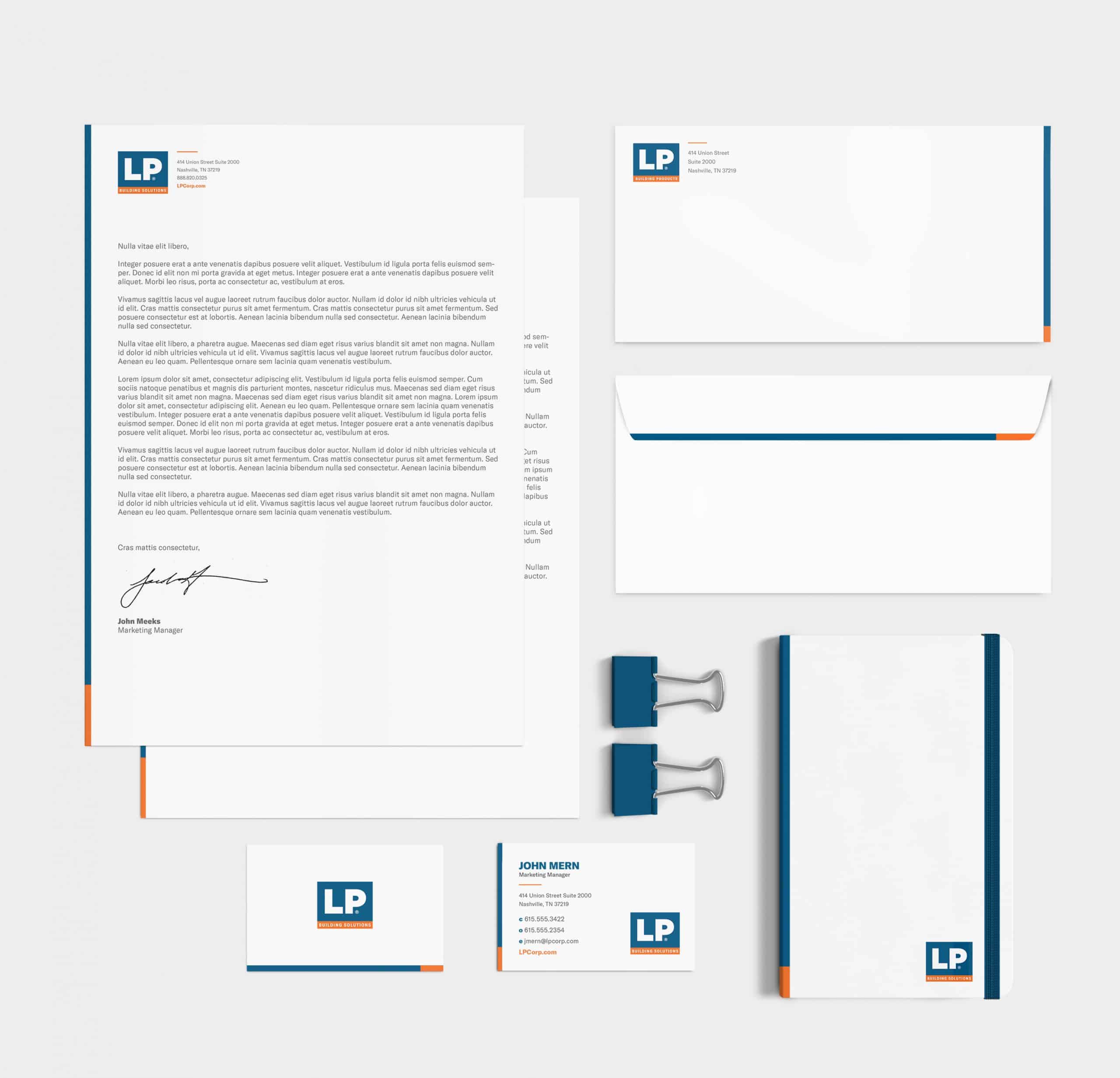 A business stationery set with a blue and orange color scheme.