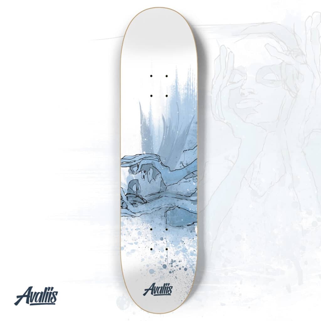 A skateboard with a drawing of a woman on it.
